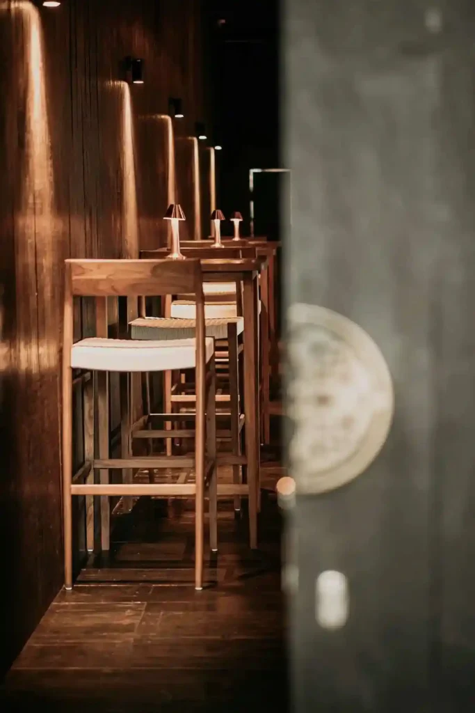 narrow bar walkway with high stools at Billy Ho modern Japanese restaurant in Canggu